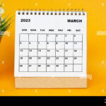 White March 2023 Calendar With Potted Plant On Yellow Background 2023